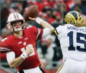  ?? MORRY GASH — THE ASSOCIATED PRESS ?? Malvern Prep grad Alex Hornibrook throws a pass for Wisconsin in the first half against Michigan.