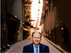  ?? ALEX GARCIA/CHICAGO TRIBUNE ?? Author Jonathan Alter, seen in the Couch Place alleyway in the Loop in 2013 above, grew up in Chicago though he now lives in New Jersey.