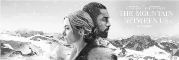  ??  ?? ‘Mountain Between Us’ follows two strangers (Winslet and Elba) stranded on a mountain after a spectacula­r plane crash.