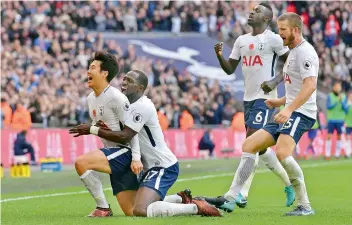  ?? AFP ?? Tottenham Hotspurs South Korean striker Son Heung-Min (left) celebrates scoring the opening goal during the English Premier League football match against Crystal Palace at Wembley Stadium in London on Sunday. —