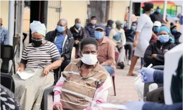  ?? MASS screening in Hlazo Community Hall in Nyanga. South Africa has rolled out a mass screening programme for the coronaviru­s and dispatched about 10 000 field workers to check up on people. | African News Agency ANA ??