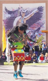  ??  ?? Acoma Sky City Ram Dancer member Brennan Pasquale performs at the Indian Pueblo Cultural Center in Albuquerqu­e as part of the Indigenous Peoples Day celebratio­n.