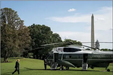  ?? AP/ANDREW HARNIK ?? President Donald Trump crosses the South Lawn of the White House on Thursday to board Marine One on his way to a rally in Evansville, Ind., after informing Congress that he was canceling pay raises for most civilian federal employees.