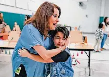  ?? ?? Jeanette Zuniga, a counselor at Maverick Elementary, embraces student Luke Salinas, who wants to be a heavy metal musician.