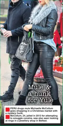  ??  ?? PERU drugs mule Michaella McCollum goes shopping in a Christmas market with a mystery hunk. McCollum, 24, jailed in 2013 for attempting to smuggle cocaine, was also seen looking at rings in a jewellery shop in Belfast.