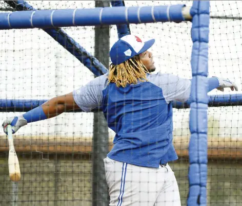  ?? NATHAN DENETTE/THE CANADIAN PRESS ?? Top Blue Jays prospect Vladimir Guerrero Jr. puts on a show Monday during batting practice in Dunedin, Fla.