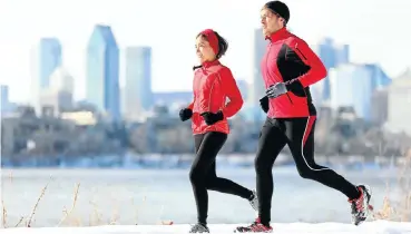  ?? Picture: 123rf.com ?? Runners in winter snow with Montreal in the background. Canada ranks highest on the Global Wellness Index.