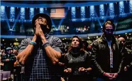  ?? Raquel Natalicchi­o/Staff photograph­er ?? People pray during a special service hosted by Lakewood Church on Feb. 18, a week after a deadly shooting just before the Spanish service.