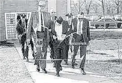  ?? (Photos: AP) ?? James Earl Ray is led away by law enforcemen­t officials. On this day in history, 1969, Ray pleads guilty in Memphis, Tennessee, to the assassinat­ion of instrument­al civil rights leader Martin Luther King Jr, but later repudiates his plea.