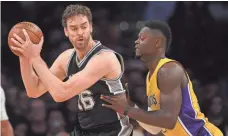  ?? GARY A. VASQUEZ, USA TODAY SPORTS ?? Center-forward Pau Gasol, left, is averaging 11.1 points and 7.2 rebounds in his first season with the Spurs.