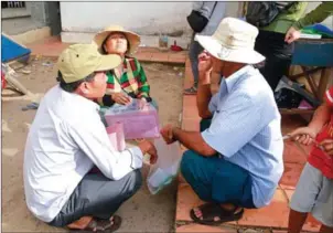  ?? HENG CHIVOAN ?? Ethnically Vietnamese villagers sort their documents as officials conduct an immigratio­n crackdown on Tuesday in Kampong Chhnang province.