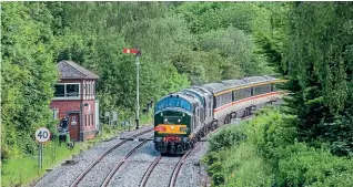  ?? JACK BOSKETT ?? The ‘Three Peaks from a Seat 2021’ charter was operated by LSL using two Class 37s. Nos. 37521 and 37677 power through Malvern Wells with a return excursion from Hereford to Crewe on June 10.