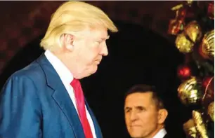  ??  ?? Donald Trump at his Mar-a-Lago residence with Michael Flynn
