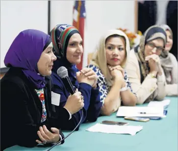  ?? Photograph­s by Francine Orr Los Angeles Times ?? LUCY SILVA, left, speaking at the #IStandWith­Hijabis event, was born in Mexico and grew up Catholic. After converting to Islam, Silva says, she had to reassure her parents. “Look, Mom, I’m still Mexican, OK?”