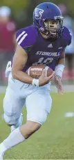  ?? PHOTO COURTESY STONEHILL ?? STRONG START: Stonehill quarterbac­k James Lam rushed for 118 yards and two touchdowns in a loss to Fairmont State.