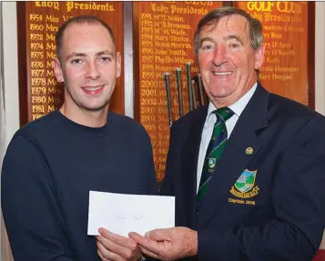  ??  ?? Winner of the grand raffle John Plant received his prize from Baltinglas­s Golf Club captain John Kelly.