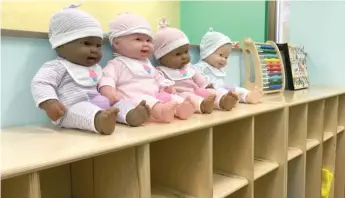  ??  ?? Dolls at a new day care room at the Leighton Criminal Courthouse. The new playroom will have space for up to 27 children and opens Thursday.
| ANDY GRIMM FOR THE SUN- TIMES