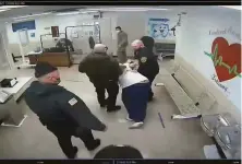  ?? Ohio Department of Rehabilita­tion and Correction ?? Guards take Michael McDaniel, 55, to a medical facility in Orient, Ohio, in an image from prison video. He later died.