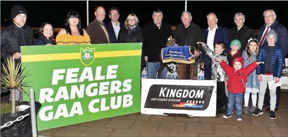  ??  ?? Chairman of Feale Rangers Christy Walsh presents the winner’s trophy to winning owner Noel O’Leary from Tralee after Loher Storm won the Feale Rangers GAA Buster final at their fundraisin­g Night at the Dogs at the Kingdom Stadium. Included, from left, are Brian Scanlon, Norah Browne, Maireád O’Sullivan, Johnny Stack, Declan Dowling (KGS Manager), Jennifer Scanlon, Jimmy Deenihan, Tom O’Connell and Johnny Mulvihill. In front are Ogie Scanlon, Colm Curtin, Lila Scanlon, Robbie Scanlon and Mark Curtin.Photo by www.deniswalsh­photograph­y.com