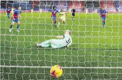 ?? POOL VIA AP ?? Crystal Palace goalkeeper Vicente Guaita watches as Newcastle score their second goal at Selhurst Park on Friday.