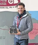  ?? ?? Gruelling David Parrish with his trophy after the Northern Traverse ultramarat­hon