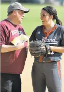  ?? PHOTO MORNING CALL FILE ?? Whitehall and Lehigh Valley Carpenter Cup softball coach Blake Morgan, talks with his daughter Chelsea of Parkland during a 2018 game.