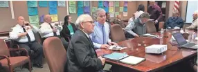  ??  ?? Colliervil­le Mayor Stan Joyner, right, and James Lewellen, town administra­tor, scrutinize budget numbers before a board budget work session on Thursday at the Colliervil­le Town Hall. LINDA A. MOORE/THE COMMERCIAL APPEAL