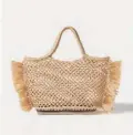  ??  ?? Espadrille small fringed raffia tote Dhs2,164 Altuzarra