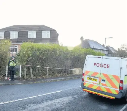  ?? ROBERT MELEN ?? Police officers at the house in the Cimla area of Neath yesterday