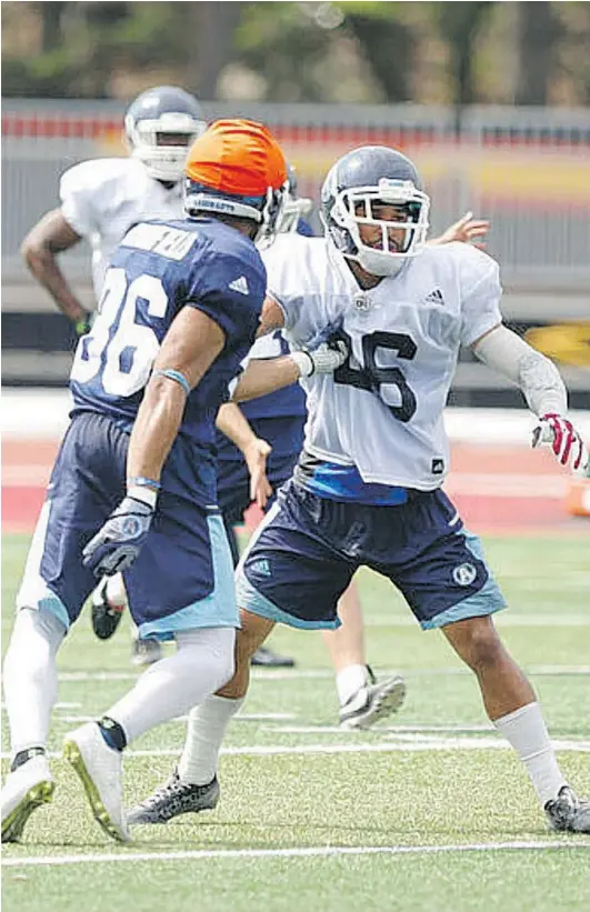  ?? JACK BOLAND/POSTMEDIA NETWORK FILES ?? Toronto Argonauts defensive back Joe Rankin, right, is anxious to return to game action.