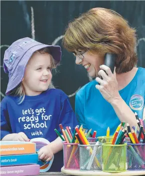  ??  ?? FIFTY’S JUST FINE: Suzanne Jeffries, a receptioni­st at Goodstart Early Learning Centre, with Hannah, 4. Picture: NAOMI JELLICOE