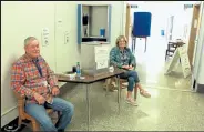  ?? Jack Harvel / Fort Morgan Times ?? Election judges Steve Simonds and Becky Oldemeyer await voters to bring in their ballots at the Morgan County Administra­tion Building before the 2019 election.