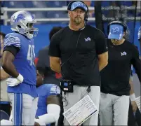  ?? DUANE BURLESON — THE ASSOCIATED PRESS ?? Dan Campbell watches from the sidelines during his first game as Detroit Lions coach Sunday against the San Francisco 49ers. Down 38-10, the Lions staged a comeback, but fell, 41-33.