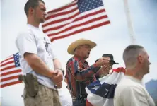  ?? John Locher / Los Vegas Review-Journal 2014 ?? Cliven Bundy (center) has played a prominent part in the deep and bitter debate over public land policy in the West.