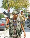  ?? – Reuters ?? PATROLLING: Members of Turkish-backed Free Syrian Army (FSA) in the border town of Jarablus in Syria, on Wednesday.