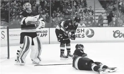  ??  JEAN LEVAC/OTTAWA CITIZEN ?? Robin Lehner, Marc Methot and Erik Karlsson of the Senators show their dejection after the third Penguins goal.