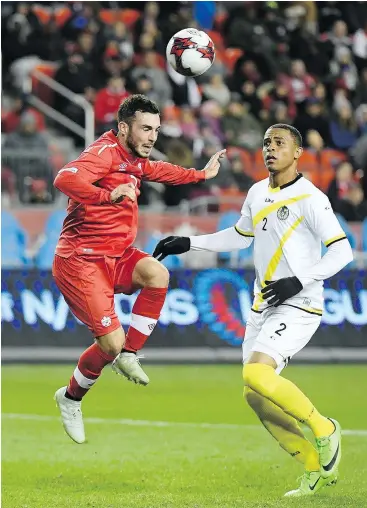  ?? — THE CANADIAN PRESS FILES ?? Canada’s Russell Teibert, left, seen in action against Dominica last month, says the squad has made history this year is many different ways.