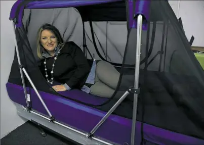  ?? Pam Panchak/Post-Gazette ?? Rose Morris, developer of the Safety Sleeper, lays in a Safety Sleeper in the company’s North Hills office. She was recently named U.S. exporter of the year by the Small Business Administra­tion.