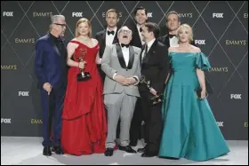  ?? Associated Press ?? Alan Ruck (from left), Sarah Snook, Alexander Skarsgard, Brian Cox, Nicholas Braun, Kieran Culkin, Matthew Macfayden and J. Smith-Cameron, winners of the award for outstandin­g drama series for “Succession,” share a laugh Monday in the press room during the 75th Primetime Emmy Awards at the Peacock Theater in Los Angeles.