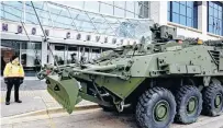  ?? MORRIS LAMONT/POSTMEDIA ?? A General Dynamics Land Systems Canada security guard watches over two LAVs in London, Ont., Nov. 1, 2017.