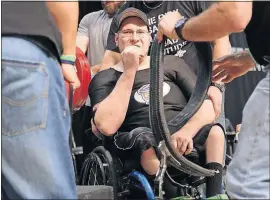  ?? [BROOKE LAVALLEY/DISPATCH] ?? Keith Stich prepares for his lift during the disabled powerlifti­ng competitio­n at the Arnold Sports Festival.