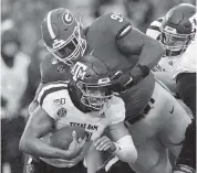  ?? KEVIN C. COX Getty Images ?? Georgia’s Jordan Davis sacks Kellen Mond of the Texas A&M Aggies. The Bulldogs got to Mond two times Saturday.