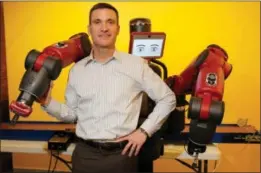  ?? JESSICA RINALDI — THE WASHINGTON POST ?? Scott Eckert, chief executive of the Boston-based Rethink Robotics, defends his industry against critics who decry robots as job killers.