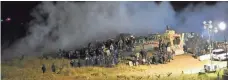  ?? MORTON COUNTY SHERIFF’S DEPARTMENT VIA AP ?? Law enforcemen­t and protesters clash near the site of the Dakota Access pipeline in North Dakota on Sunday.