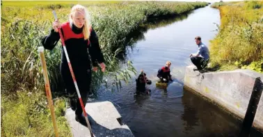  ?? ASSOCIATED PRESS FILE PHOTO ?? Police and other authoritie­s search a waterway for remains related to the Kim Wall murder investigat­ion onAug. 23 on the west coast of Amager close to Copenhagen, Denmark.