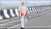  ??  ?? Prime Minister Narendra Modi stands on the DholaSadiy­a river bridge — the country’s longest — in Assam on Friday. PTI PHOTO