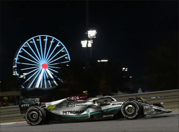  ?? Hassan Ammar The Associated Press ?? Lewis Hamilton steers his car during the 2022 running of the Bahrain Formula One Grand Prix, the location for the start of the 2023 season this weekend.