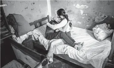  ?? MERIDITH KOHUT/THE NEW YORK TIMES 2020 ?? A mother with her 13-year-old daughter at their home in Merida, Venezuela. The girl had an abortion that has helped spur debate about further legalizing the procedure in the South American country.