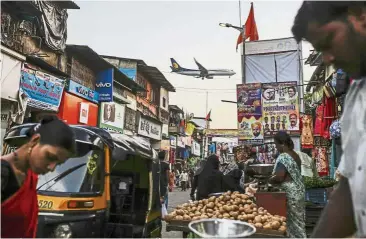  ??  ?? Tough time: A plane preparing to land at Chhatrapat­i Shivaji Internatio­nal Airport in Mumbai. Losses at Indian carriers will balloon to as much as US$1.9bil in the year ending March 2019, and they need to raise more than US$3bil in working capital in the near term. — Bloomberg