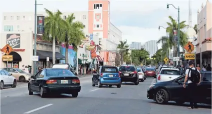  ?? SANDY HOOPER/USA TODAY ?? Historic Calle Ocho cuts through the middle of Little Havana. The once predominan­tly Cuban neighborho­od has changed dramatical­ly in recent years, the result of developmen­t and rapidly changing demographi­cs.